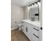 Updated bathroom features a quartz vanity, marble tile, and black fixtures at 1943 Hallwood Dr, Las Vegas, NV 89119