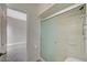 Bathroom with shower/tub combo and frosted glass door at 1976 Caballero Way, Las Vegas, NV 89169