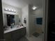Bathroom with vanity, shower, and tile flooring at 2200 S Fort Apache Rd # 1207, Las Vegas, NV 89117