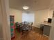 Bright dining area with wood-look flooring and corner window at 2200 S Fort Apache Rd # 1207, Las Vegas, NV 89117
