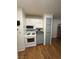 White appliances and gray cabinets in this kitchen at 2200 S Fort Apache Rd # 1207, Las Vegas, NV 89117