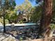 Relaxing community pool with patio furniture and lush landscaping at 2200 S Fort Apache Rd # 1207, Las Vegas, NV 89117