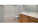 Bathroom featuring a shower-tub combo, white sink, and vanity at 2204 Twin Falls Dr, Henderson, NV 89044