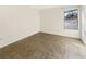 Empty bedroom with tile flooring and large window at 2300 E Silverado Ranch Blvd # 1136, Las Vegas, NV 89183