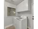 Laundry room with washer, dryer, and cabinets at 341 Oak Canyon Dr, Henderson, NV 89015