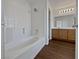 Clean bathroom featuring a tub and wood-look floors at 3615 American Pie Ct, Las Vegas, NV 89129
