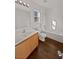 Bathroom with wood cabinets, a bathtub, and tile floor at 3615 American Pie Ct, Las Vegas, NV 89129