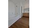 Bathroom with a bathtub, wood-look floors and a vanity at 3615 American Pie Ct, Las Vegas, NV 89129
