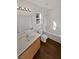 Bathroom with wood cabinets, a bathtub, and tile floor at 3615 American Pie Ct, Las Vegas, NV 89129