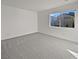 Spacious bedroom with grey carpet and large window at 3615 American Pie Ct, Las Vegas, NV 89129
