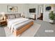 Virtually staged main bedroom with wood-like floors and ample light at 3615 American Pie Ct, Las Vegas, NV 89129