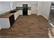 Modern kitchen with wood countertops and tile floors at 3615 American Pie Ct, Las Vegas, NV 89129
