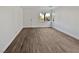 Empty living room with wood-look floors and neutral walls at 3615 American Pie Ct, Las Vegas, NV 89129