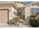 Front entry with wrought iron gate and mature shrubs at 3828 Terrace Grove St, Las Vegas, NV 89129