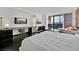 Modern bedroom with city views and a desk area at 4381 W Flamingo Rd # 3519, Las Vegas, NV 89103