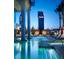 Resort-style pool and spa area with city views at night at 4381 W Flamingo Rd # 3519, Las Vegas, NV 89103
