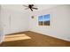 Spacious bedroom with tile floors and a ceiling fan at 4520 Harmon Cir, Las Vegas, NV 89122