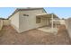 Private backyard with covered patio and gravel at 5044 Droubay Dr, Las Vegas, NV 89122