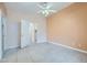 Bright bedroom with tile floors and ceiling fan, with access to closet and laundry at 5044 Droubay Dr, Las Vegas, NV 89122