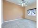 Bright bedroom with tile flooring and ceiling fan at 5044 Droubay Dr, Las Vegas, NV 89122