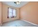 Spacious bedroom with tile floors and window coverings at 5044 Droubay Dr, Las Vegas, NV 89122