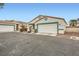 Two-house exterior view showing desert landscaping and attached garages at 5044 Droubay Dr, Las Vegas, NV 89122