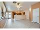 Open concept living room and kitchen with tile flooring and neutral walls at 5044 Droubay Dr, Las Vegas, NV 89122
