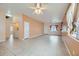 Living area with tile floors, neutral walls, and a view into laundry room at 5044 Droubay Dr, Las Vegas, NV 89122