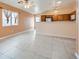 Living room with tile floors and kitchen views, neutral color scheme at 5044 Droubay Dr, Las Vegas, NV 89122