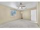 Bright bedroom with ceiling fan and carpet flooring at 5838 Heather Marie Dr, Las Vegas, NV 89110