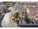 Two-story house and surrounding neighborhood, aerial view at 585 Dairy Creek Ave, Las Vegas, NV 89183