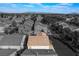 House exterior and surrounding neighborhood shown in this aerial view at 585 Dairy Creek Ave, Las Vegas, NV 89183