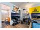 Bedroom with large TV, bathroom access, and workspace at 585 Dairy Creek Ave, Las Vegas, NV 89183