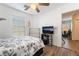 Bedroom with full bed, TV, and access to another room at 585 Dairy Creek Ave, Las Vegas, NV 89183