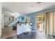 Kitchen with breakfast bar and access to backyard at 585 Dairy Creek Ave, Las Vegas, NV 89183