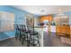 Kitchen with light wood cabinets, breakfast bar and island at 585 Dairy Creek Ave, Las Vegas, NV 89183