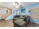 Living room with L-shaped sectional sofa and staircase at 585 Dairy Creek Ave, Las Vegas, NV 89183