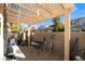 Patio with pergola, table, and chairs at 585 Dairy Creek Ave, Las Vegas, NV 89183