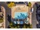 Community pool with lounge chairs and umbrellas at 585 Dairy Creek Ave, Las Vegas, NV 89183