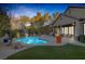 Inviting backyard oasis featuring a sparkling pool, spa, and covered patio at 6336 San Gagano Ave, Las Vegas, NV 89131