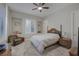 Bright bedroom with comfy bed, ceiling fan and window shutters at 6336 San Gagano Ave, Las Vegas, NV 89131