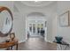 Elegant entryway with tile flooring, large mirror, and views to the living area at 6336 San Gagano Ave, Las Vegas, NV 89131