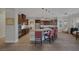 Open kitchen with dark wood cabinetry, granite countertops, and ample seating at 6336 San Gagano Ave, Las Vegas, NV 89131