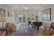 Spacious living room with piano, comfortable seating, and access to backyard at 6336 San Gagano Ave, Las Vegas, NV 89131
