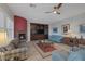 Living room featuring fireplace, built-in shelving, and ample seating at 6336 San Gagano Ave, Las Vegas, NV 89131