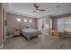 Main bedroom with hardwood floors and access to private patio at 6336 San Gagano Ave, Las Vegas, NV 89131