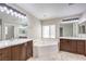 Double vanity bathroom with soaking tub and separate shower at 6553 Churnet Valley Ave, Las Vegas, NV 89139