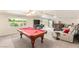 Basement featuring a pool table, wet bar and plenty of space for entertaining and relaxation at 6595 Creekside Cellars Ct, Las Vegas, NV 89139
