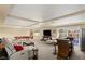 Finished basement with a pool table, TV, bar, sectional and access to the backyard at 6595 Creekside Cellars Ct, Las Vegas, NV 89139