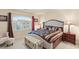 Bedroom features a decorative accent pillows, trunk and a sitting area with ample lighting at 6595 Creekside Cellars Ct, Las Vegas, NV 89139